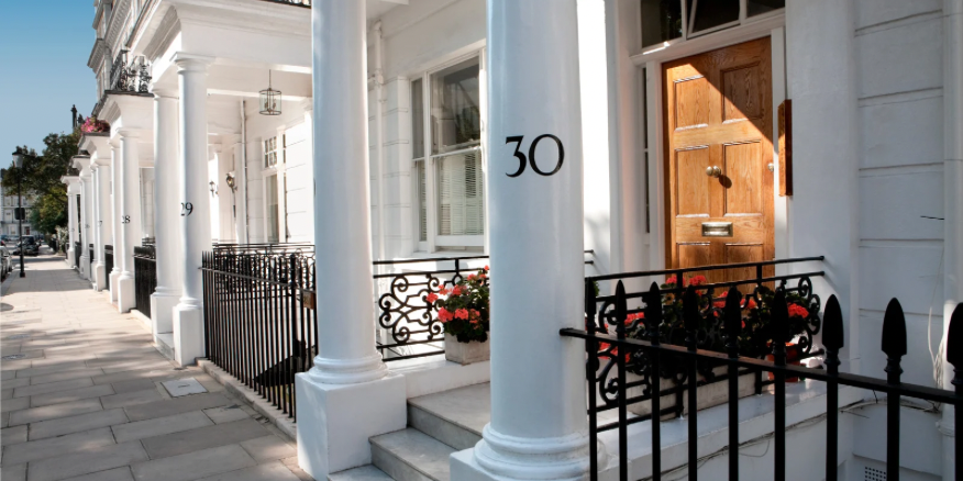 Photo of the front of a White House in central London, with traditional columns and stairs in the entryway.